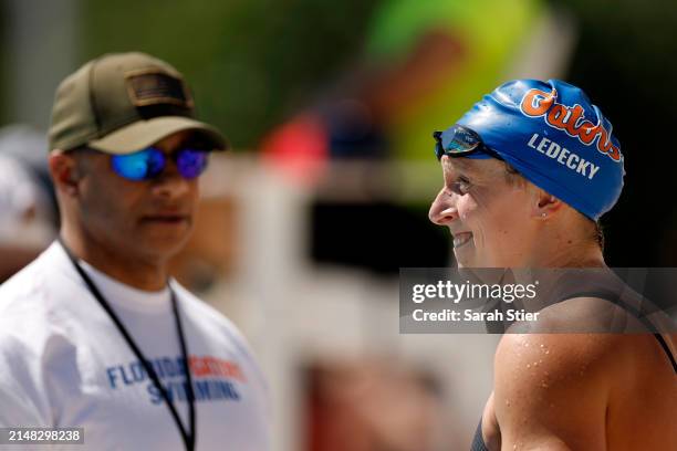 Katie Ledecky talks with her coach Anthony Nesty after competing in the Women's 400m Freestyle on Day 2 of the TYR Pro Swim Series San Antonio at...