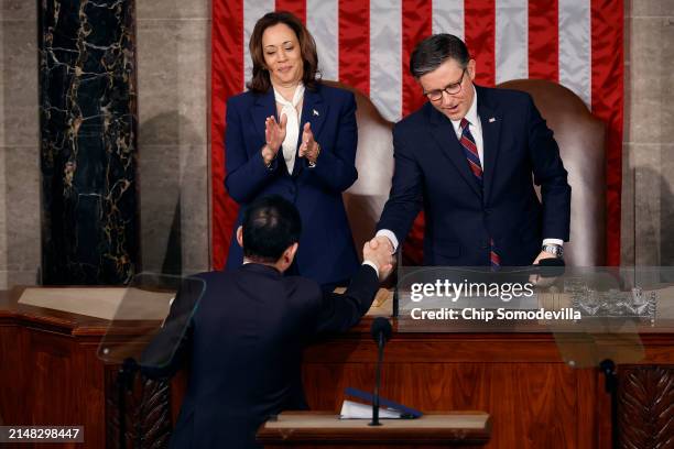 Vice President Kamala Harris and Speaker of the House Mike Johnson shake hands with Japanese Prime Minister Fumio Kishida after he addressed a joint...