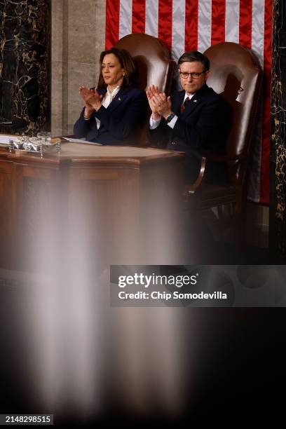 Vice President Kamala Harris and Speaker of the House Mike Johnson applaud for Japanese Prime Minister Fumio Kishida as he addresses a joint meeting...