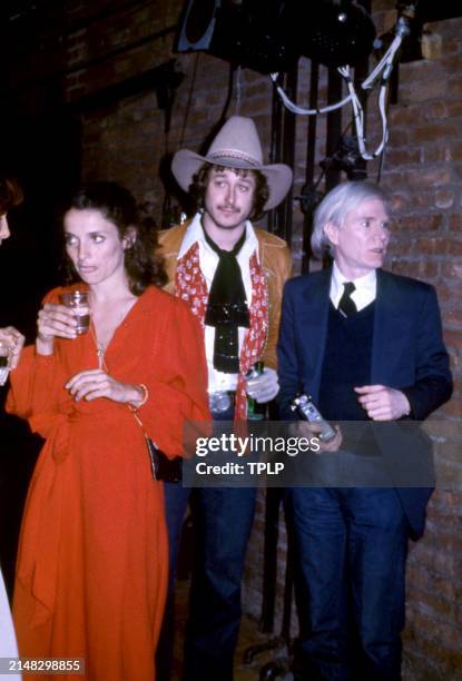 Canadian activist Margaret Trudeau, American singer Tom Sullivan and American visual artist Andy Warhol walk around at the Manhattan nightclub and...