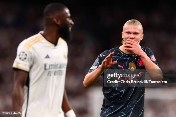 Erling Haaland of Manchester City makes a point to Antonio Rudiger of Real Madrid during the UEFA Champions League quarter-final first leg match...