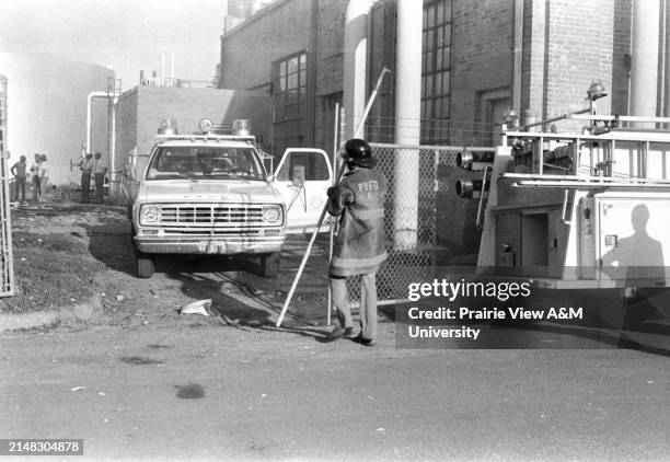 First responders gather around the ruins of a burned down building at Prairie View A&M University in the 1980s.