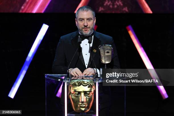 Nelson Calvinho accepts the Multiplayer Award on behalf of the Development Team for 'Super Mario Bros. Wonder' during the BAFTA Games Awards 2024 at...