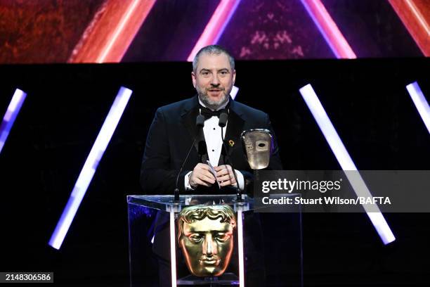 Nelson Calvinho accepts the Multiplayer Award on behalf of the Development Team for 'Super Mario Bros. Wonder' during the BAFTA Games Awards 2024 at...