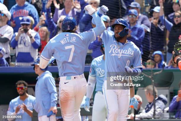 Bobby Witt Jr. #7 of the Kansas City Royals celebrates his two-run home run with Maikel Garcia in the first inning against the Houston Astros at...