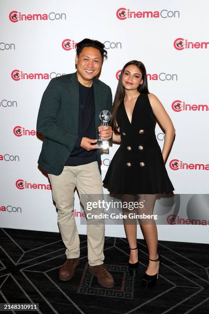 Jon M. Chu, recipient of the Martin Scorsese Legend Of Cinema Award, and Ariana Greenblatt attend the Legend Of Cinema Luncheon during CinemaCon 2024...