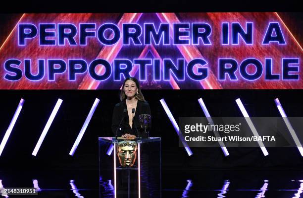 Eleanor Matsuura presents the Performer in a Supporting Role Award during the BAFTA Games Awards 2024 at the Queen Elizabeth Hall on April 11, 2024...