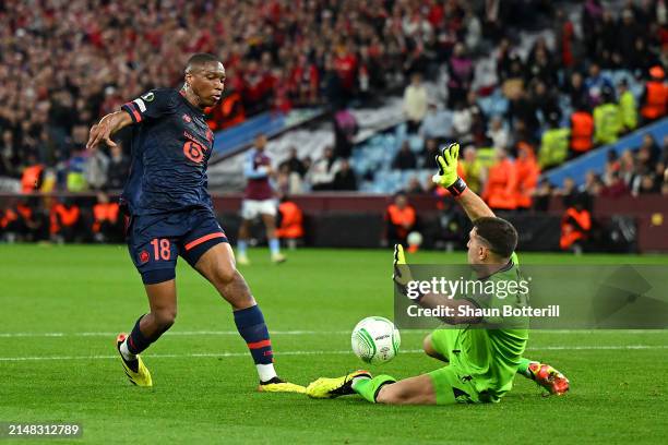 Emiliano Martinez of Aston Villa saves the shot of Bafode Diakite of Lille during the UEFA Europa Conference League 2023/24 Quarter-final first leg...