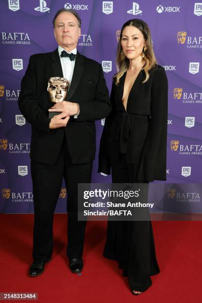 Andrew Wincott with the Performer in a Supporting Role Award for the portrayal of Raphael in 'Baldur's Gate 3' and Eleanor Matsuura during the BAFTA...
