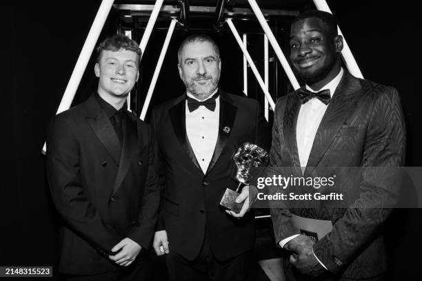 Braydon Bent , BAFTA Young Presenter & Inel Tomlinson present Nelson Calvinho winner of the Family Award on behalf of the Development Team for 'Super...