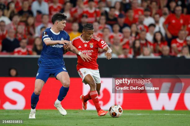 David Neres of SL Benfica, Leonardo Balerdi of Olympique Marseille battle for the ball during the UEFA Europa League 2023/24 Quarter-Final first leg...