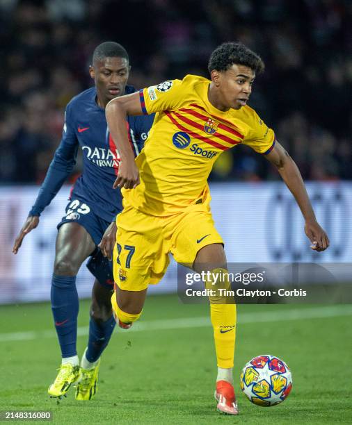 Lamine Yamal of Barcelona defended by Nuno Mendes of Paris Saint-Germain during the Paris Saint-Germain V Barcelona, UEFA Champions League,...