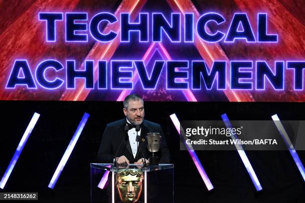 Nelson Calvinho accepts the Multiplayer Award on behalf of the Development Team for 'Super Mario Bros. Wonder' during the BAFTA Games Awards 2024 at...