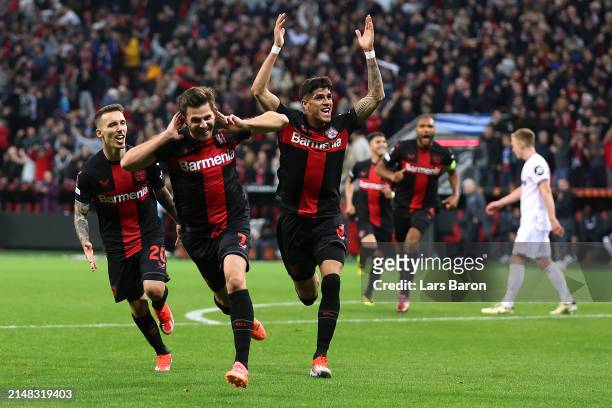Jonas Hofmann of Bayer Leverkusen celebrates with teammates after scoring his team's first goal during the UEFA Europa League 2023/24 Quarter-Final...
