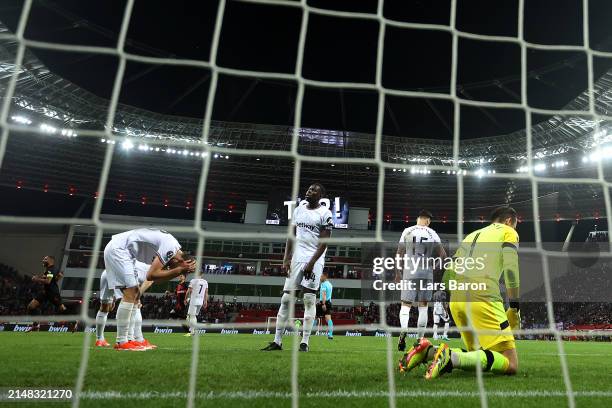 Tomas Soucek, Kurt Zouma, Konstantinos Mavropanosand Lukasz Fabianski of West Ham United look dejected after Jonas Hofmann of Bayer Leverkusen scores...