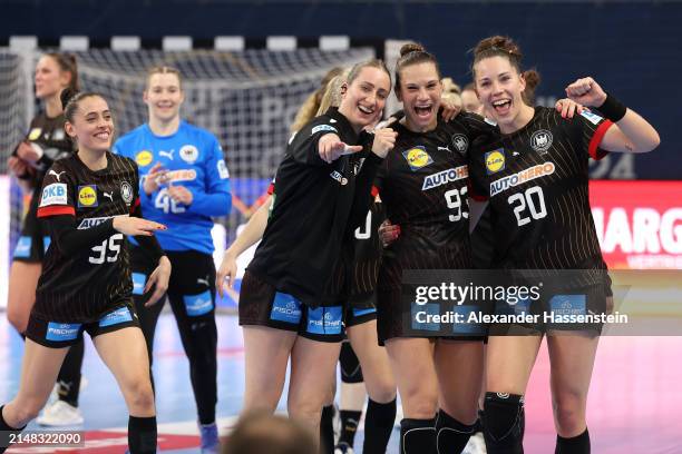 Players of Germany celebrate victory after winning the qualification match between Germany and Slovenia of the 2024 IHF Women's Olympic Qualification...