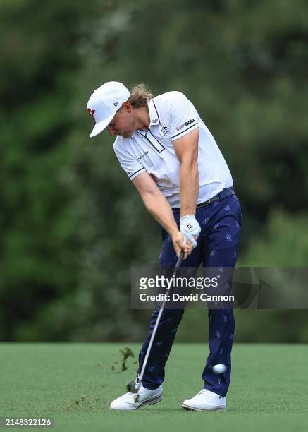 Cameron Smith of Australia plays his second shot on the fifth hole during the first round of the 2024 Masters Tournament at Augusta National Golf...