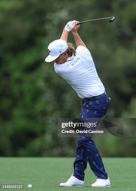 Cameron Smith of Australia plays his second shot on the fifth hole during the first round of the 2024 Masters Tournament at Augusta National Golf...