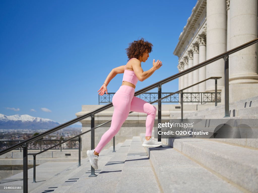 Woman Running Up Steps
