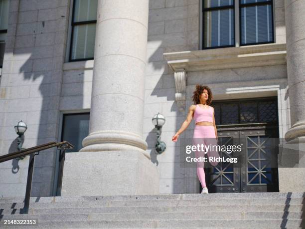 woman athlete stretching - government building steps stock pictures, royalty-free photos & images