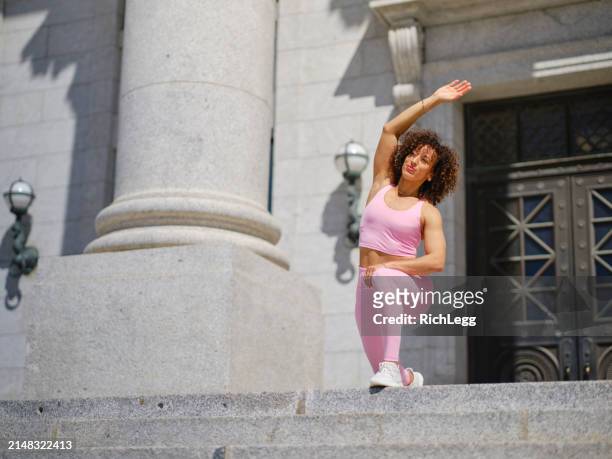 woman athlete stretching - government building steps stock pictures, royalty-free photos & images