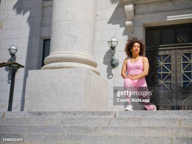 woman athlete stretching - government building steps stock pictures, royalty-free photos & images