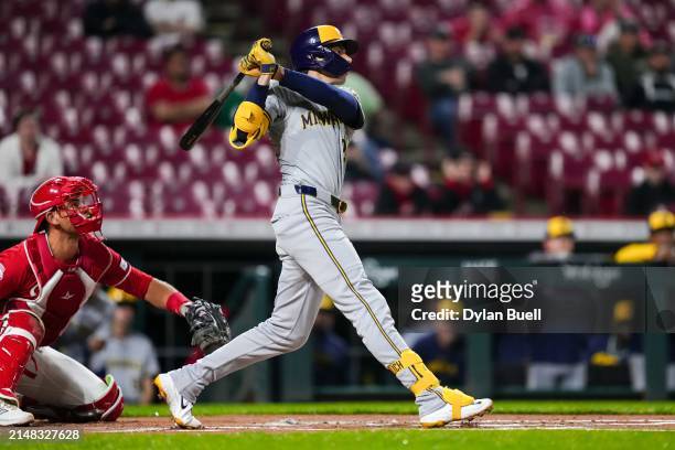 Christian Yelich of the Milwaukee Brewers hits a home run in the first inning against the Cincinnati Reds at Great American Ball Park on April 10,...
