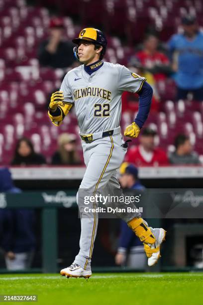 Christian Yelich of the Milwaukee Brewers rounds the bases after hitting a home run in the first inning against the Cincinnati Reds at Great American...