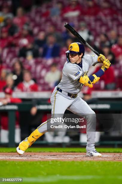 Christian Yelich of the Milwaukee Brewers bats in the second inning against the Cincinnati Reds at Great American Ball Park on April 10, 2024 in...