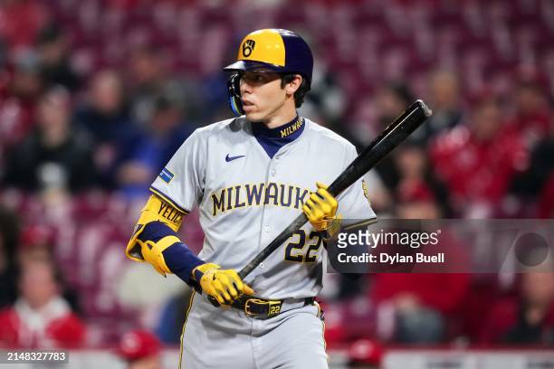Christian Yelich of the Milwaukee Brewers bats in the second inning against the Cincinnati Reds at Great American Ball Park on April 10, 2024 in...