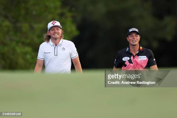 Cameron Smith of Australia and Viktor Hovland of Norway walk on the 18th fairway during the first round of the 2024 Masters Tournament at Augusta...