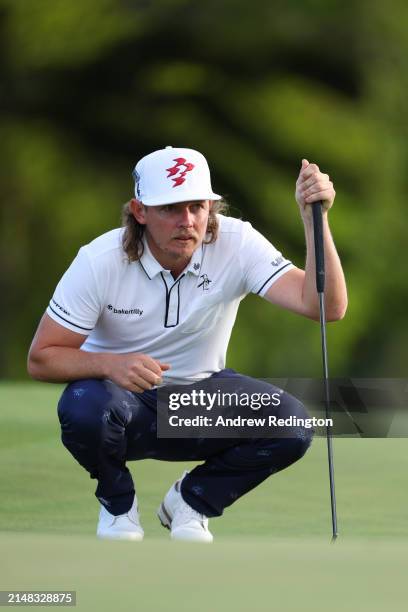 Cameron Smith of Australia lines up a putt on the 18th green during the first round of the 2024 Masters Tournament at Augusta National Golf Club on...