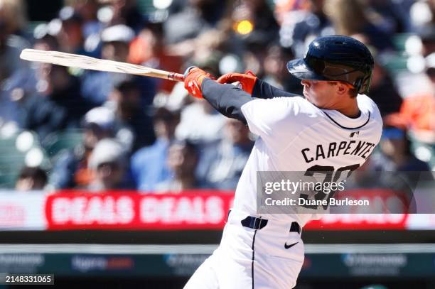 Kerry Carpenter of the Detroit Tigers breaks his bat hitting a foul ball near third base for an out against the Oakland Athletics at Comerica Park on...