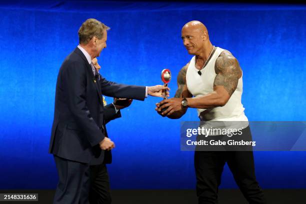 Dwayne Johnson accepts the NATO Spirit of the Industry Award from Bob... News Photo - Getty Images