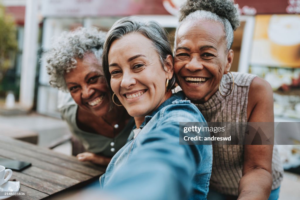 Portrait group of friends taking selfie
