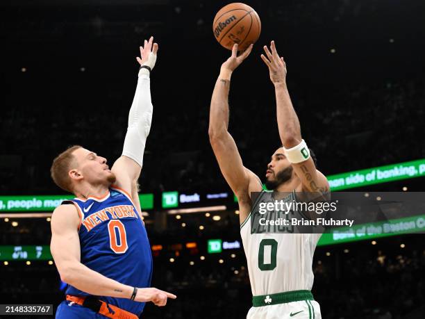 Jayson Tatum of the Boston Celtics attempts a three-point basket against Donte DiVincenzo of the New York Knicks during the third quarter at the TD...