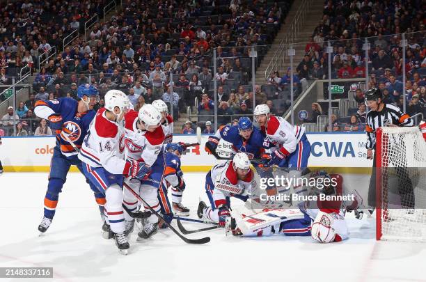 Sam Montembeault and the Montreal Canadiens defend against the New York Islanders at UBS Arena on April 11, 2024 in Elmont, New York.