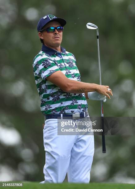 Rickie Fowler of The United States plays his tee shot on the fourth hole during the first round of the 2024 Masters Tournament at Augusta National...