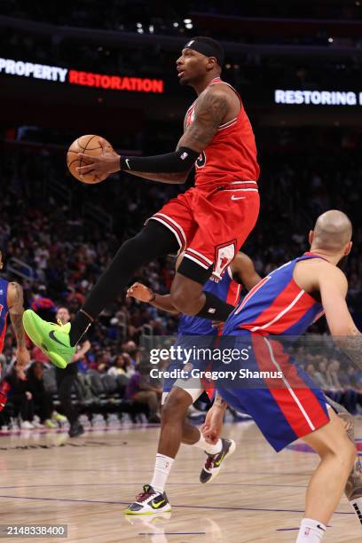 Torrey Craig of the Chicago Bulls drives to the basket past Chimezie Metu of the Detroit Pistons during the second half at Little Caesars Arena on...