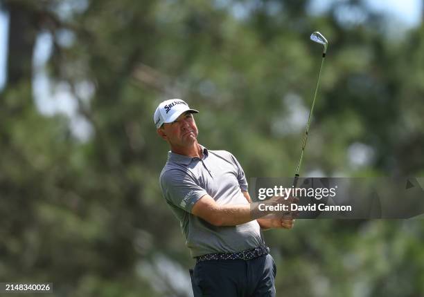 Lucas Glover of The United States plays his tee shot on the fourth hole during the first round of the 2024 Masters Tournament at Augusta National...