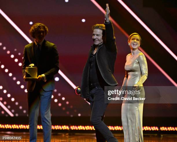 Dennis Quaid, recipient of the Cinema Icon Award, and Laura Savoie Quaid onstage during the CinemaCon Big Screen Achievement Awards at The Colosseum...