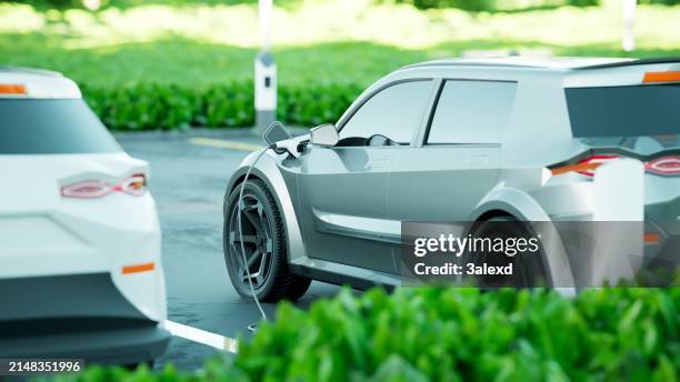 electric car charging - hybrid vehicle stock pictures, royalty-free photos & images