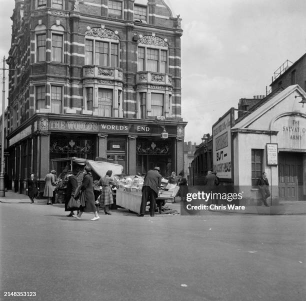 The stalls of a small street market outside The World's End public house, alongside the Salvation Army, on Blantyre Street in Chelsea, West London,...