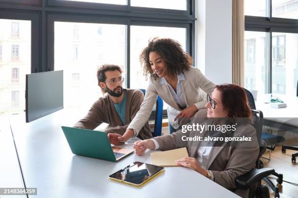 woman with disabilities and diverse group of people working in a project in a modern office - strategy execution stock pictures, royalty-free photos & images