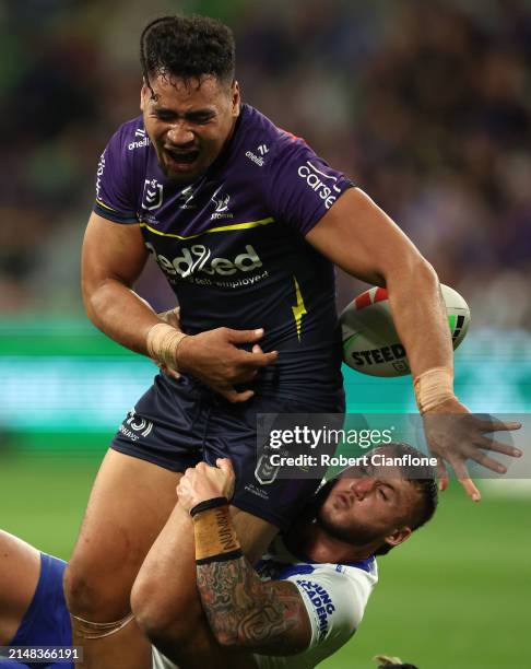 Eliesa Katoa of the Storm is challenged by Bronson Xerri of the Bulldogs during the round six NRL match between Melbourne Storm and Canterbury...