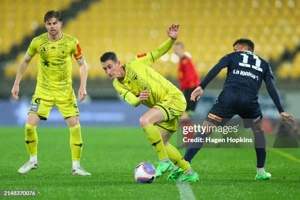 Bozhidar Kraev of the Phoenix wins the ball from Ben Folami of the Victory during the A-League Men round 24 match between Wellington Phoenix and...