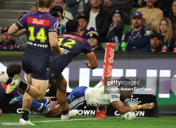 Josh Addo-Carr of the Bulldogs scores a try during the round six NRL match between Melbourne Storm and Canterbury Bulldogs at AAMI Park, on April 12...