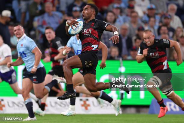 Sevu Reece of the Crusaders makes a break away during the round eight Super Rugby Pacific match between NSW Waratahs and Crusaders at Allianz...