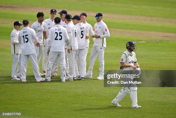 Adam Lyth of Yorkshire leaves the field dejected after being caught by Cameron Bancroft of Gloucestershire during day one of the Vitality County...