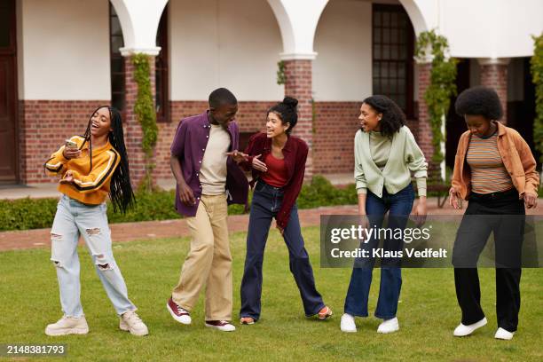 happy students enjoying break at campus - high school dance stock pictures, royalty-free photos & images